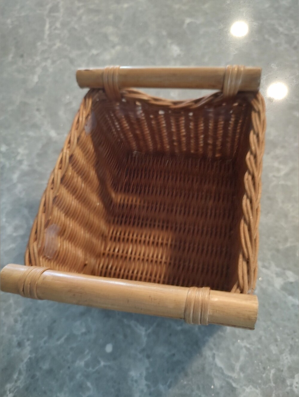 Small Basket with handles 9 inches length x 7 1/2 inches width x 5 1/2 inches he